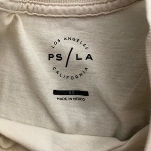 cream colored t-shirt. never worn